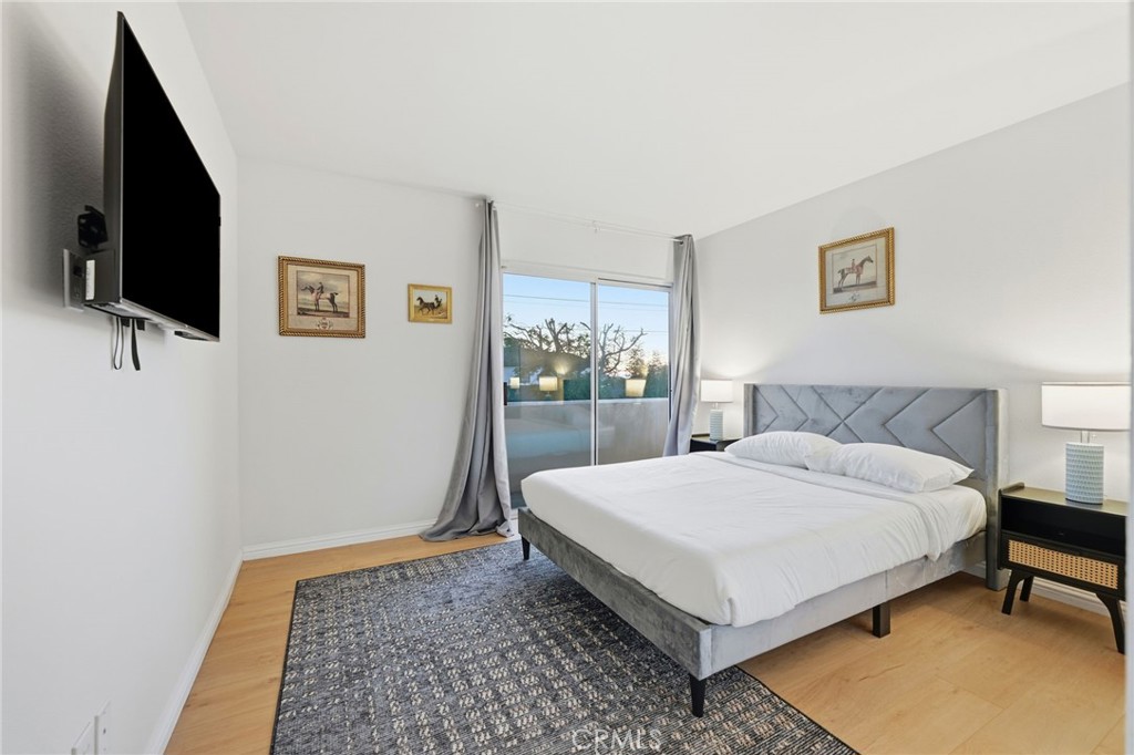 12815 Via Nestore Del Mar, CA 92014 - Photo 23 of 42 a bedroom with a bed and a flat screen tv