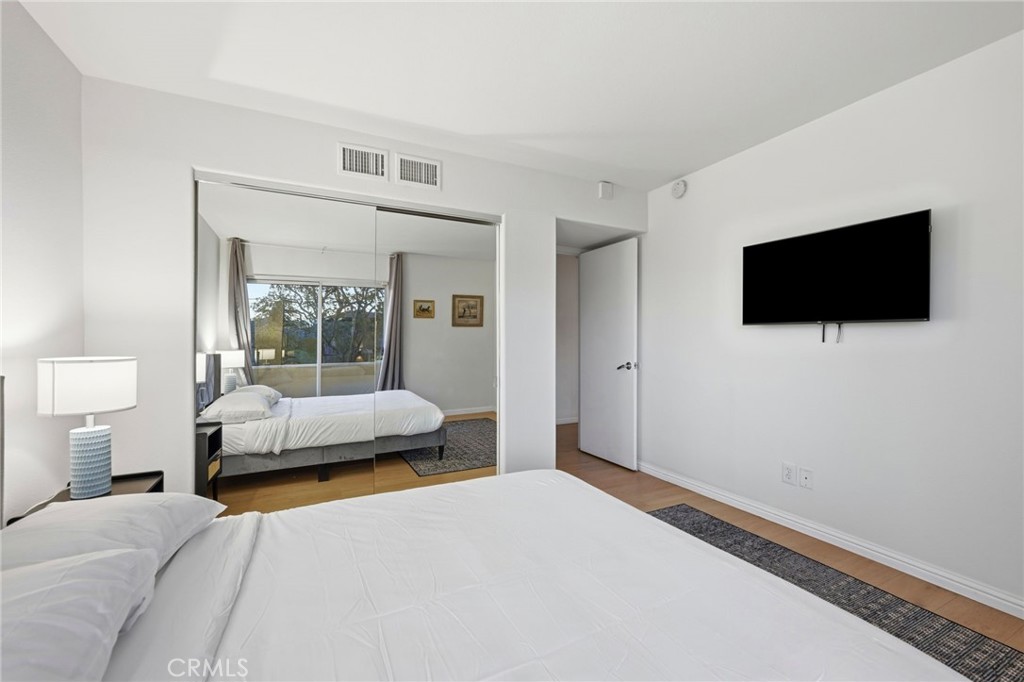 12815 Via Nestore Del Mar, CA 92014 - Photo 24 of 42 a bedroom with a bed and a flat screen tv