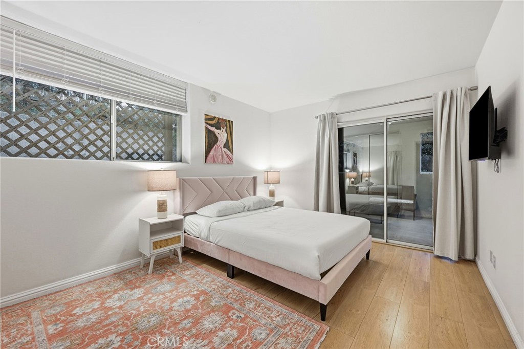 12815 Via Nestore Del Mar, CA 92014 - Photo 27 of 42 a bedroom with a bed and a flat tv screen on dresser