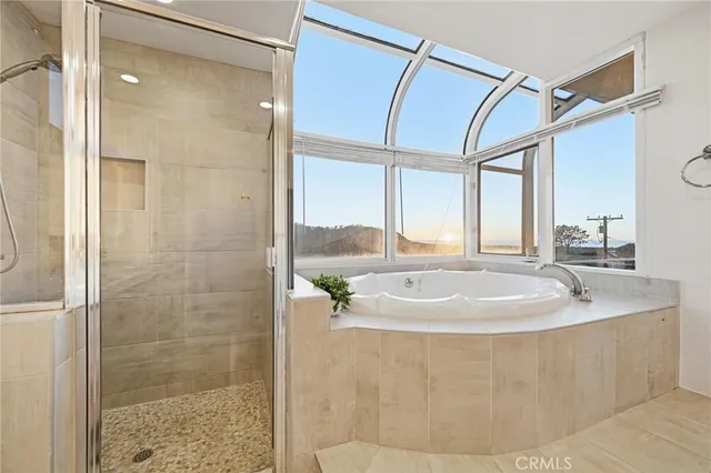 a bathroom with a sink a mirror and a shower