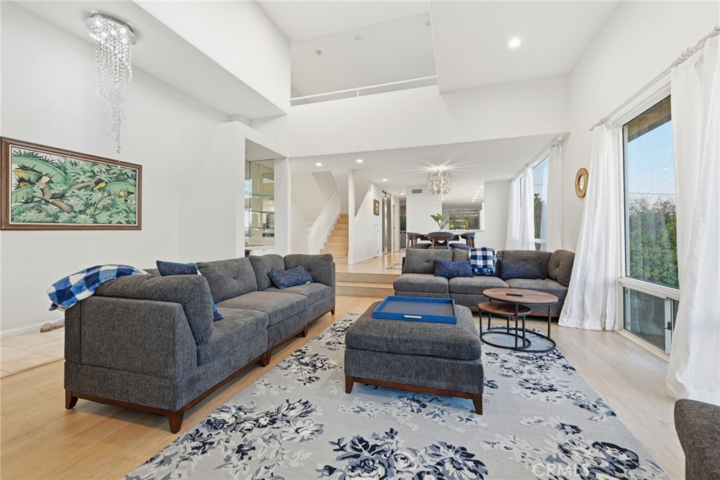 12815 Via Nestore Del Mar, CA 92014 - Photo 5 of 42 a living room with furniture wooden floor and a large window