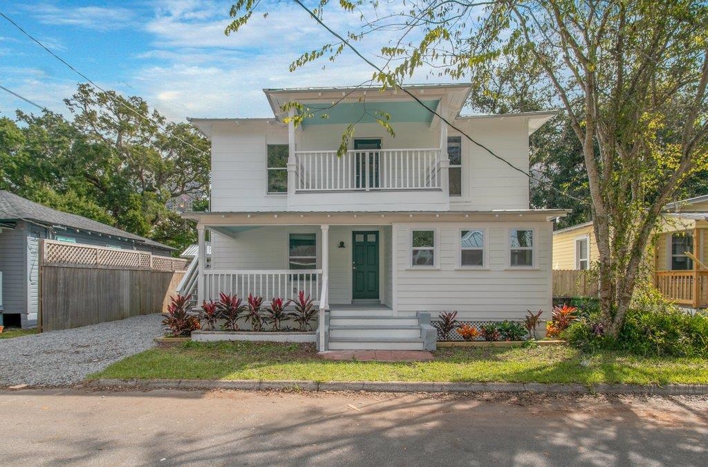 95 Keith Street St. Augustine, FL 32084 - Photo 2 of 49 a front view of a house with a yard and garage