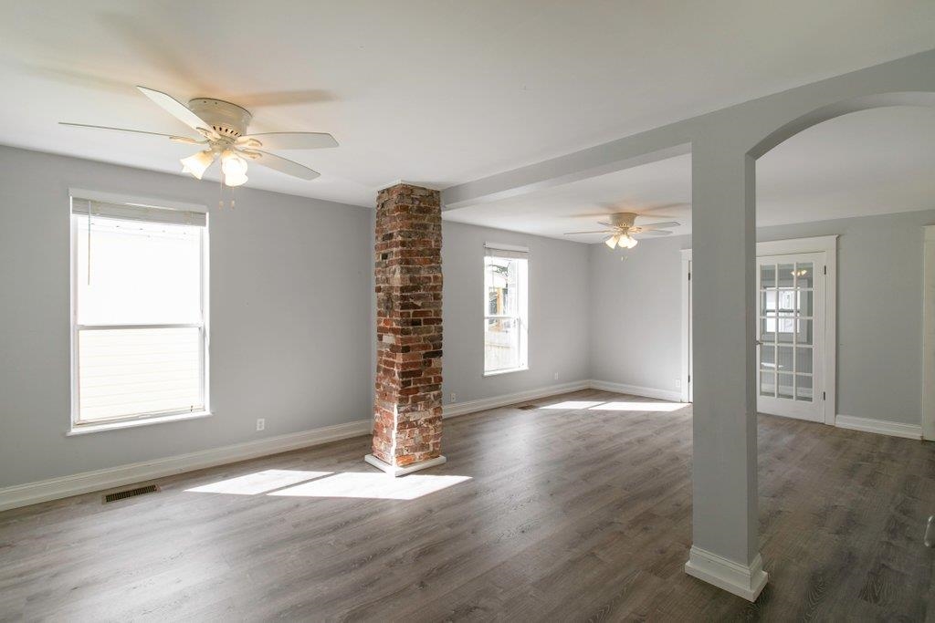 95 Keith Street St. Augustine, FL 32084 - Photo 14 of 49 a view of an empty room with a window and wooden floor