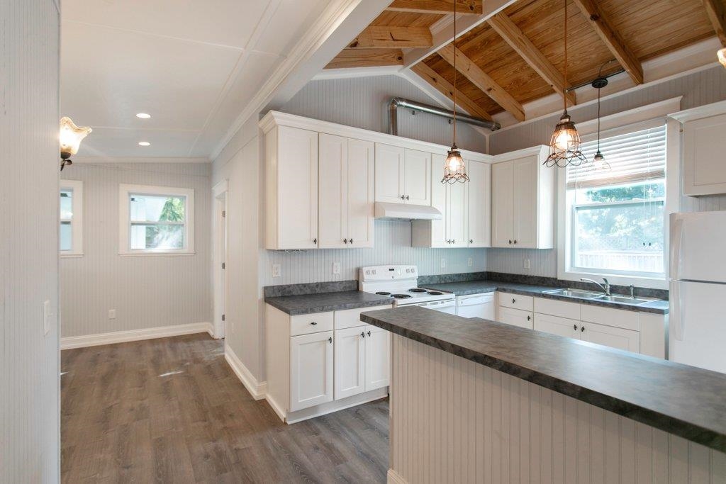 95 Keith Street St. Augustine, FL 32084 - Photo 21 of 49 a kitchen that has a sink a stove and cabinets