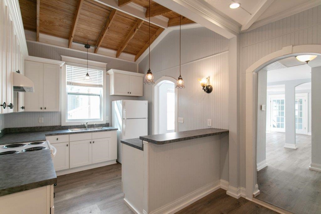 95 Keith Street St. Augustine, FL 32084 - Photo 24 of 49 a kitchen with granite countertop a sink and a refrigerator