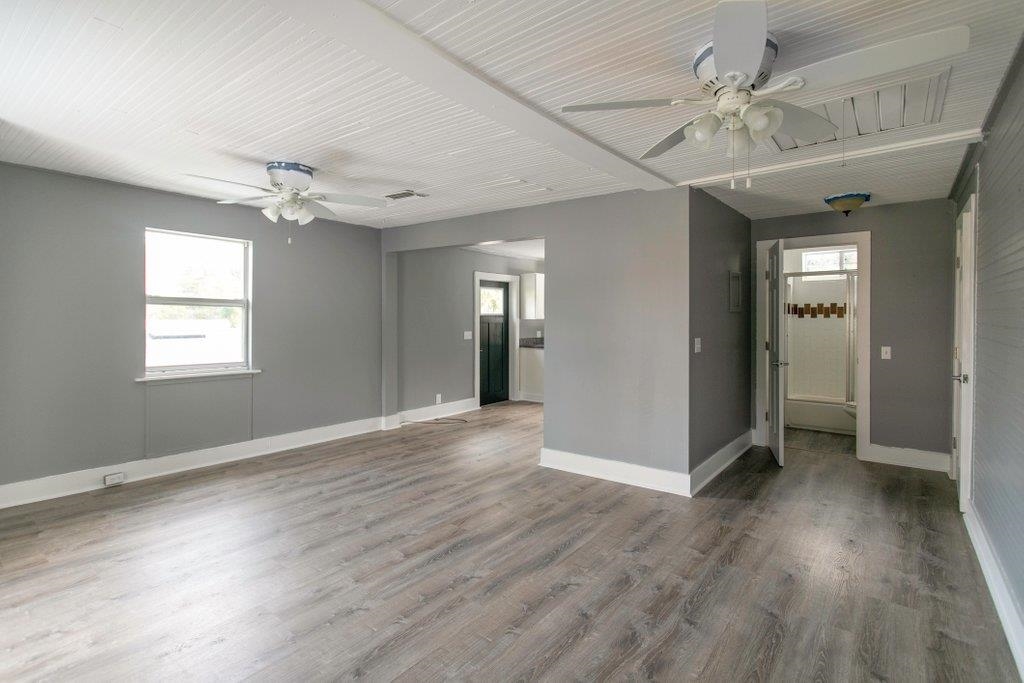 95 Keith Street St. Augustine, FL 32084 - Photo 30 of 49 wooden floor in an empty room with a window