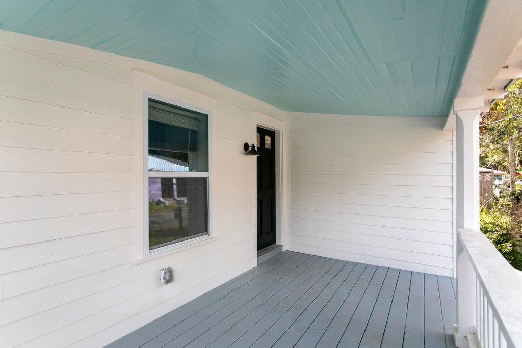 95 Keith Street St. Augustine, FL 32084 - Photo 32 of 49 a view of a hallway with wooden floor and cabinet