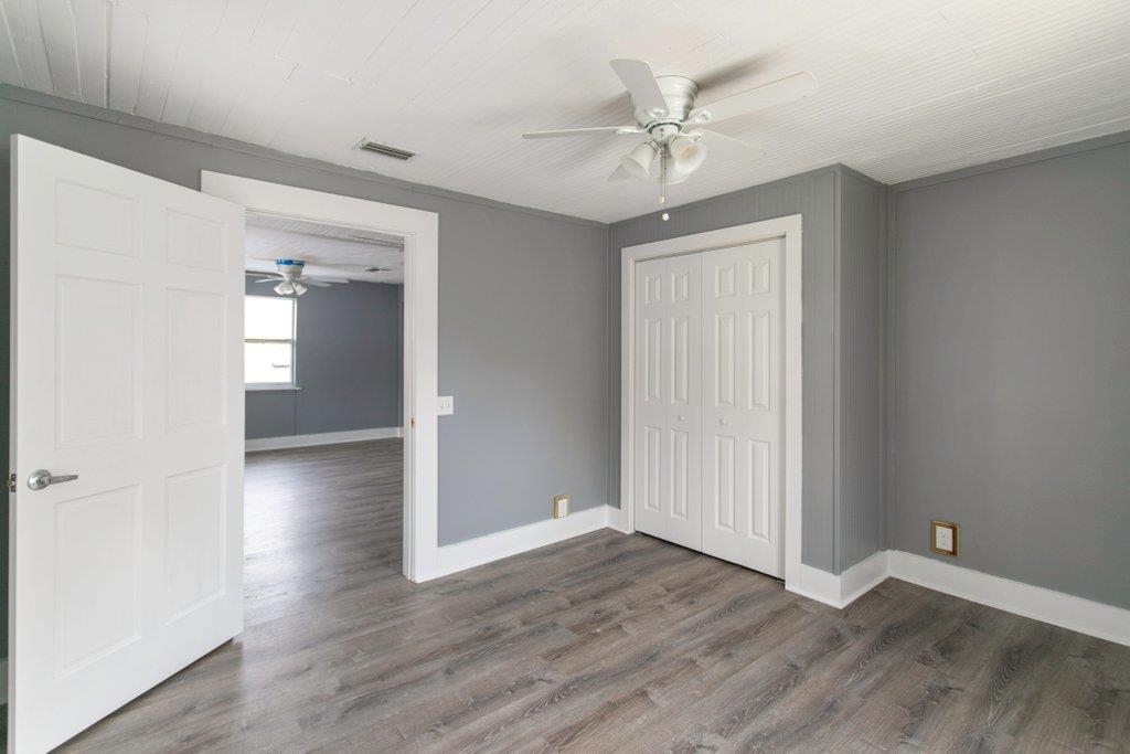 95 Keith Street St. Augustine, FL 32084 - Photo 34 of 49 wooden floor in an empty room with a window
