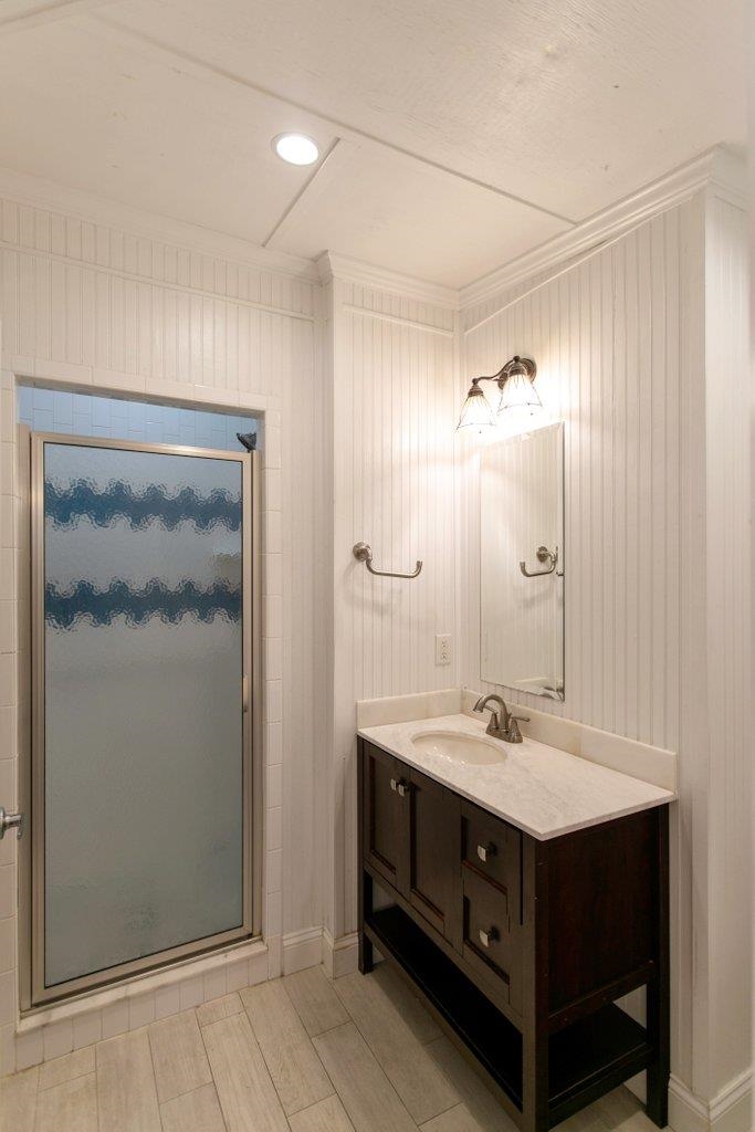 95 Keith Street St. Augustine, FL 32084 - Photo 35 of 49 a bathroom with a sink double vanity and a mirror