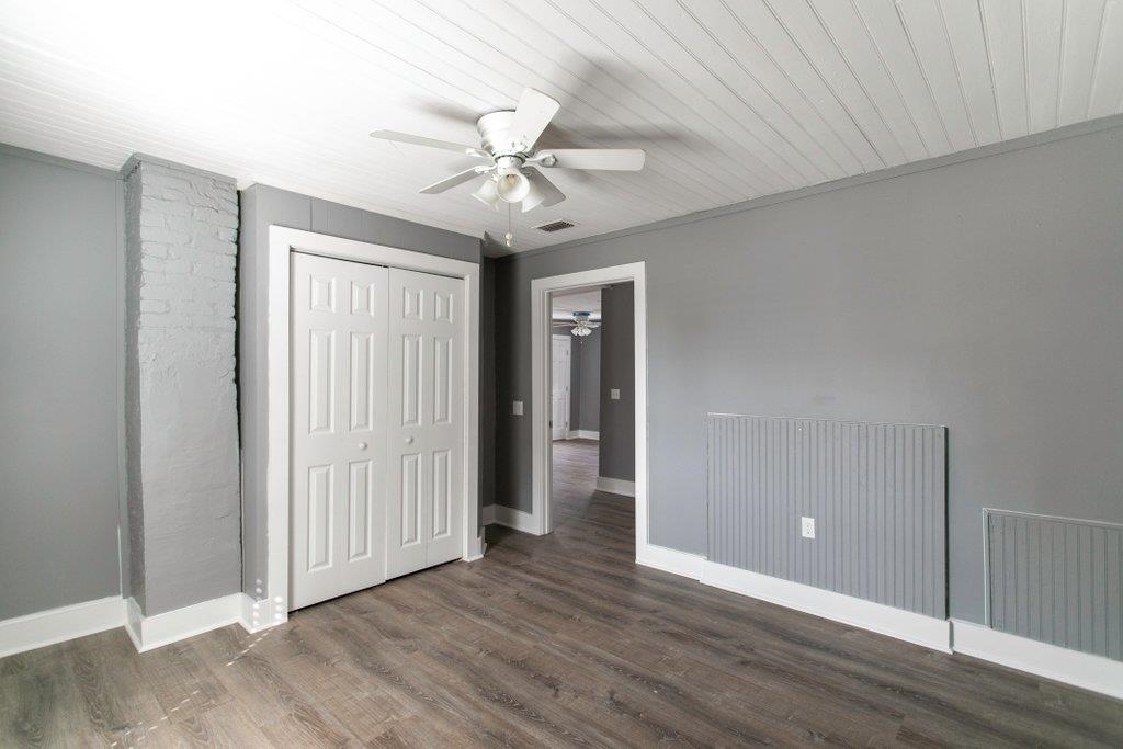 95 Keith Street St. Augustine, FL 32084 - Photo 37 of 49 an empty room with wooden floor fan and windows