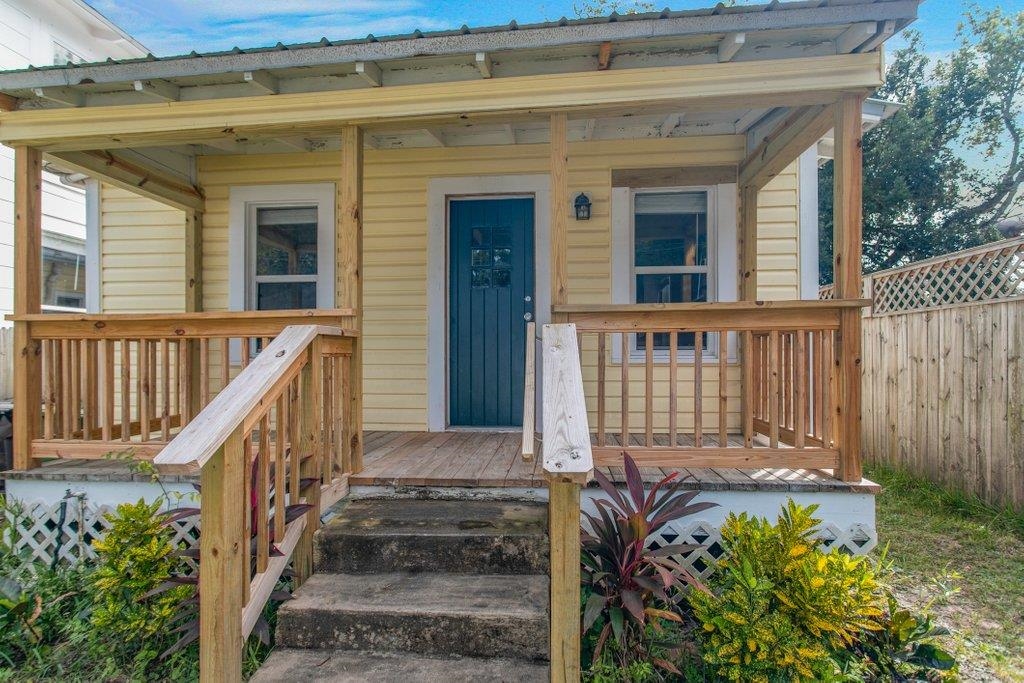 95 Keith Street St. Augustine, FL 32084 - Photo 39 of 49 a view of a house with wooden fence next to a yard