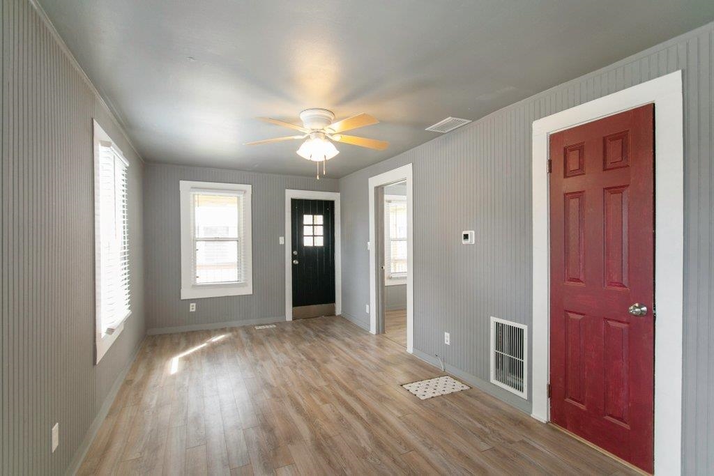 95 Keith Street St. Augustine, FL 32084 - Photo 42 of 49 wooden floor and windows in an empty room with a window
