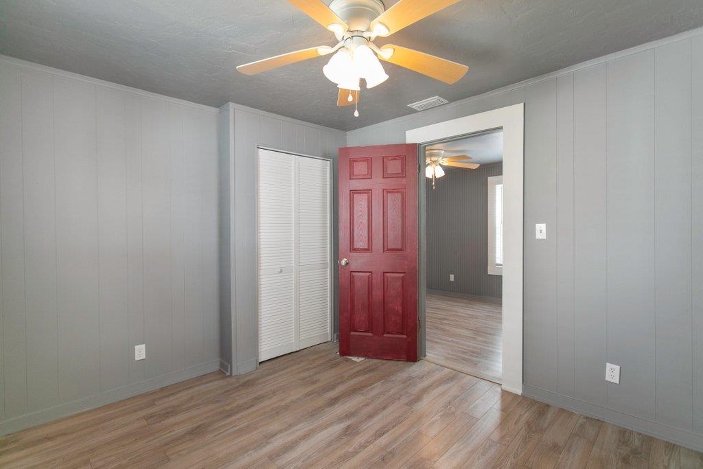 95 Keith Street St. Augustine, FL 32084 - Photo 43 of 49 wooden floor in an empty room with a mirror