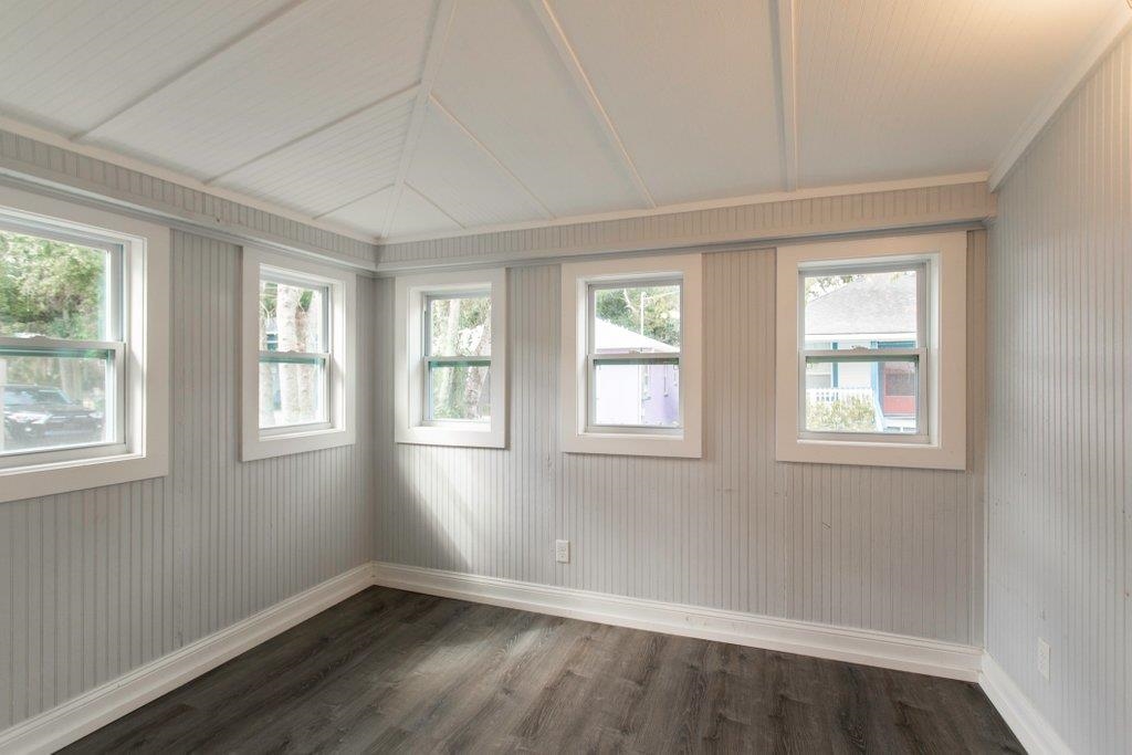 95 Keith Street St. Augustine, FL 32084 - Photo 10 of 49 a view of an empty room with wooden floor and windows