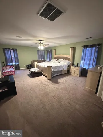 a view of a porch with furniture and a potted plants