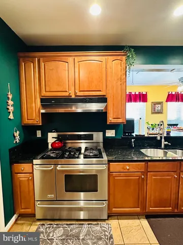 a view of staircase with wooden floor and windows