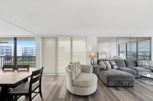 a dining room with furniture and window