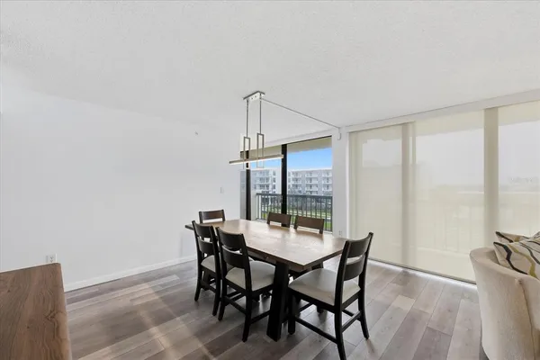 a view of a dining room with furniture window and outside view