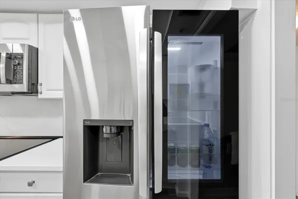 a kitchen with stainless steel appliances a sink stove and cabinets