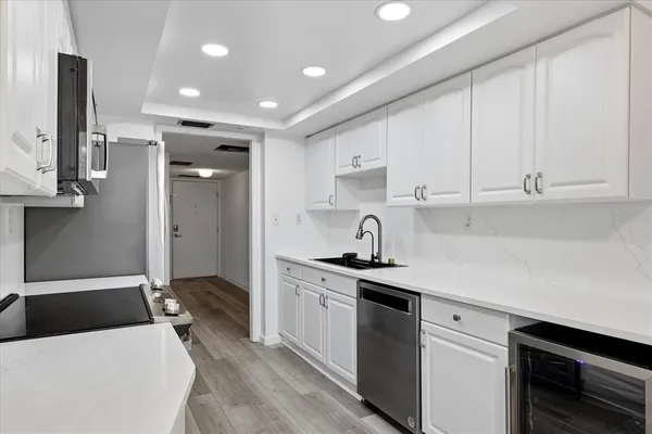 a stove top oven sitting inside of a kitchen