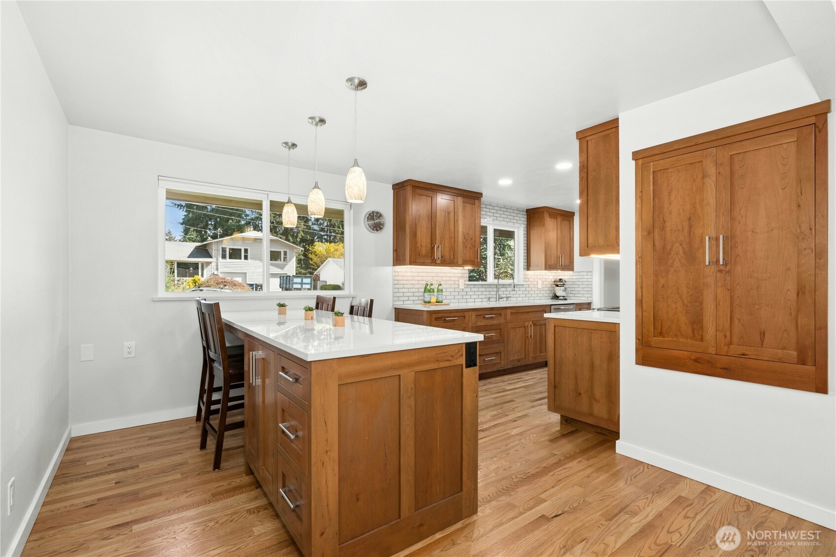24022 4th Place West Bothell, WA 98021 - Photo 11 of 36 a kitchen with a sink cabinets and wooden floor