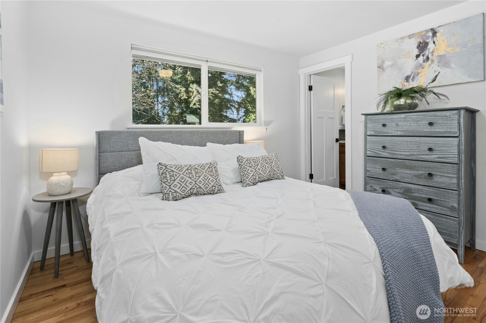 24022 4th Place West Bothell, WA 98021 - Photo 16 of 36 a bedroom with a bed and a painting on the wall