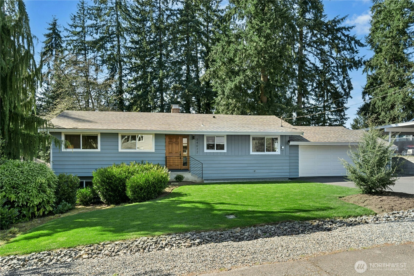 24022 4th Place West Bothell, WA 98021 - Photo 2 of 36 a front view of a house with a garden