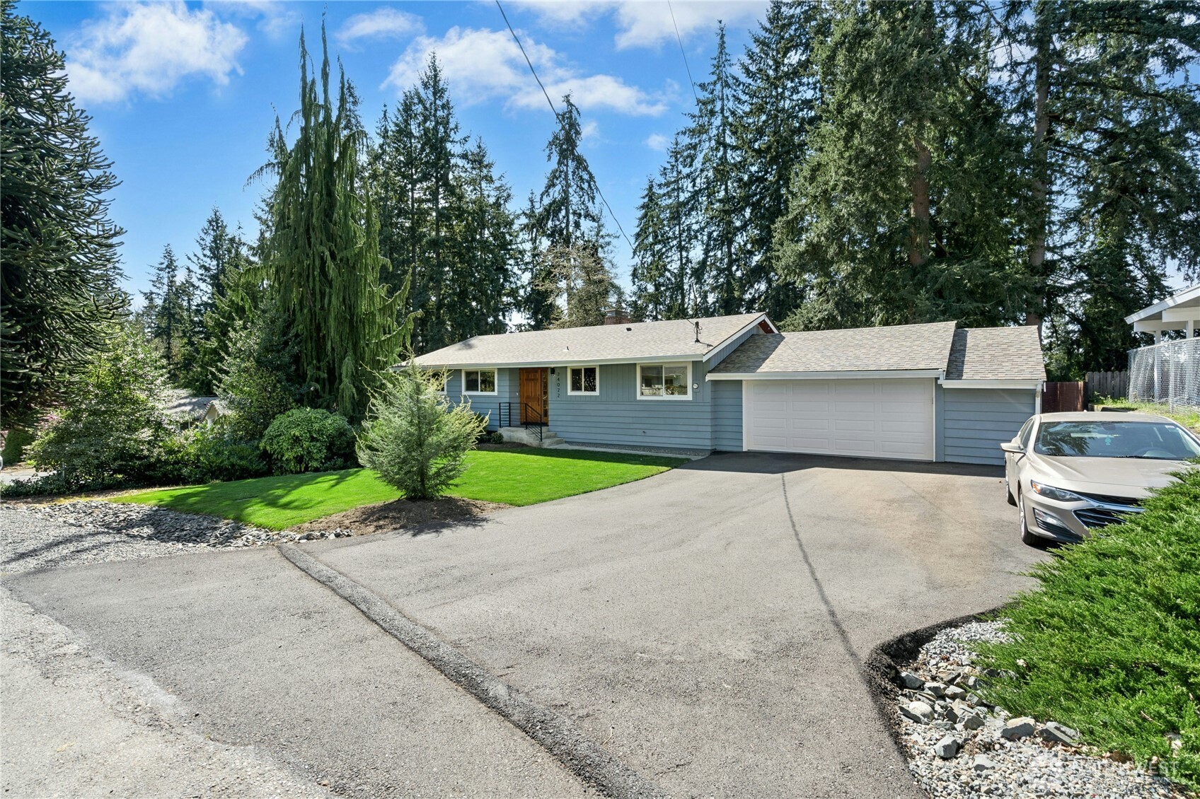 24022 4th Place West Bothell, WA 98021 - Photo 3 of 36 a view of a house with a yard and large tree