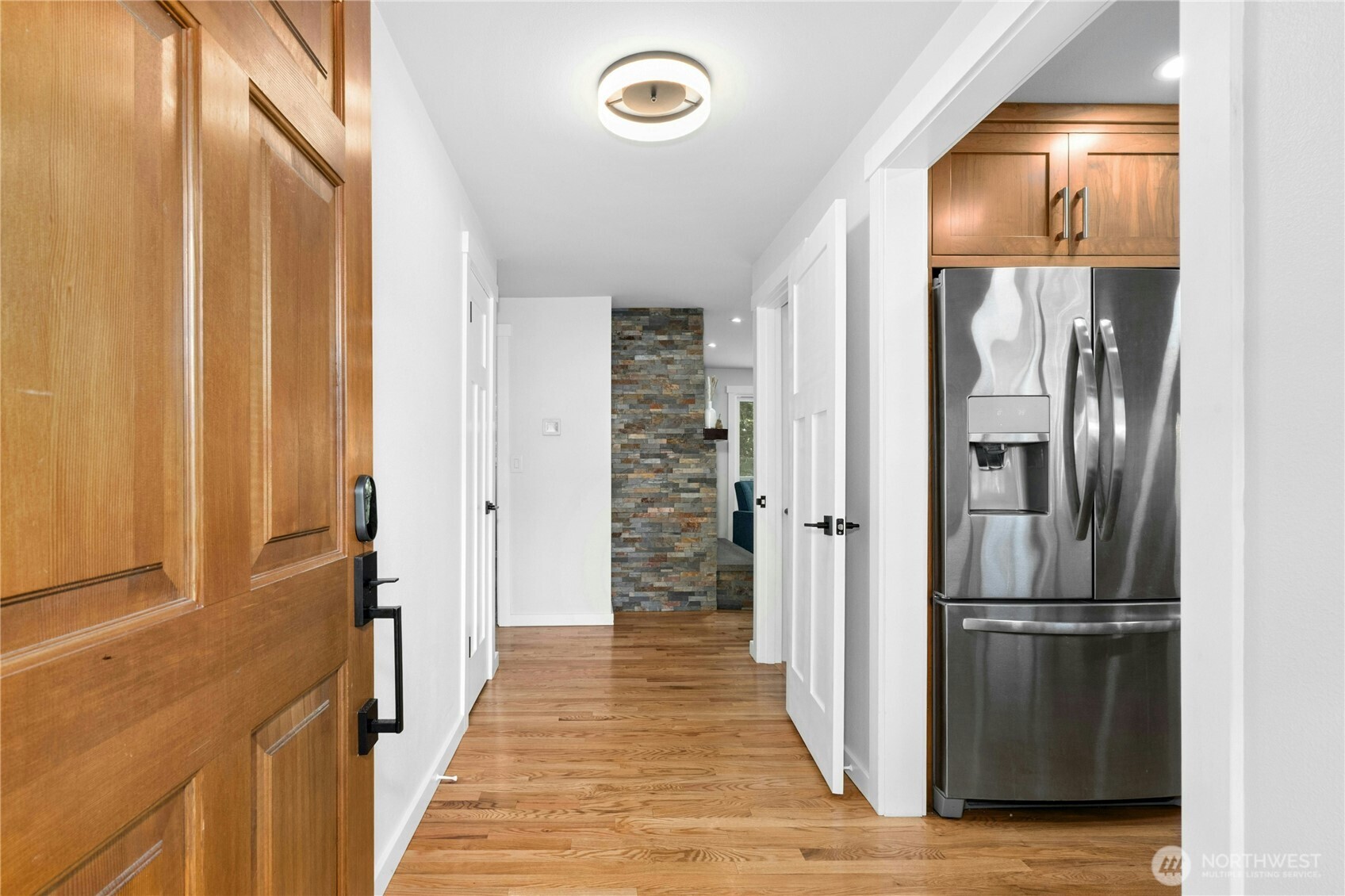 24022 4th Place West Bothell, WA 98021 - Photo 5 of 36 a view of a hallway with wooden floor and staircase