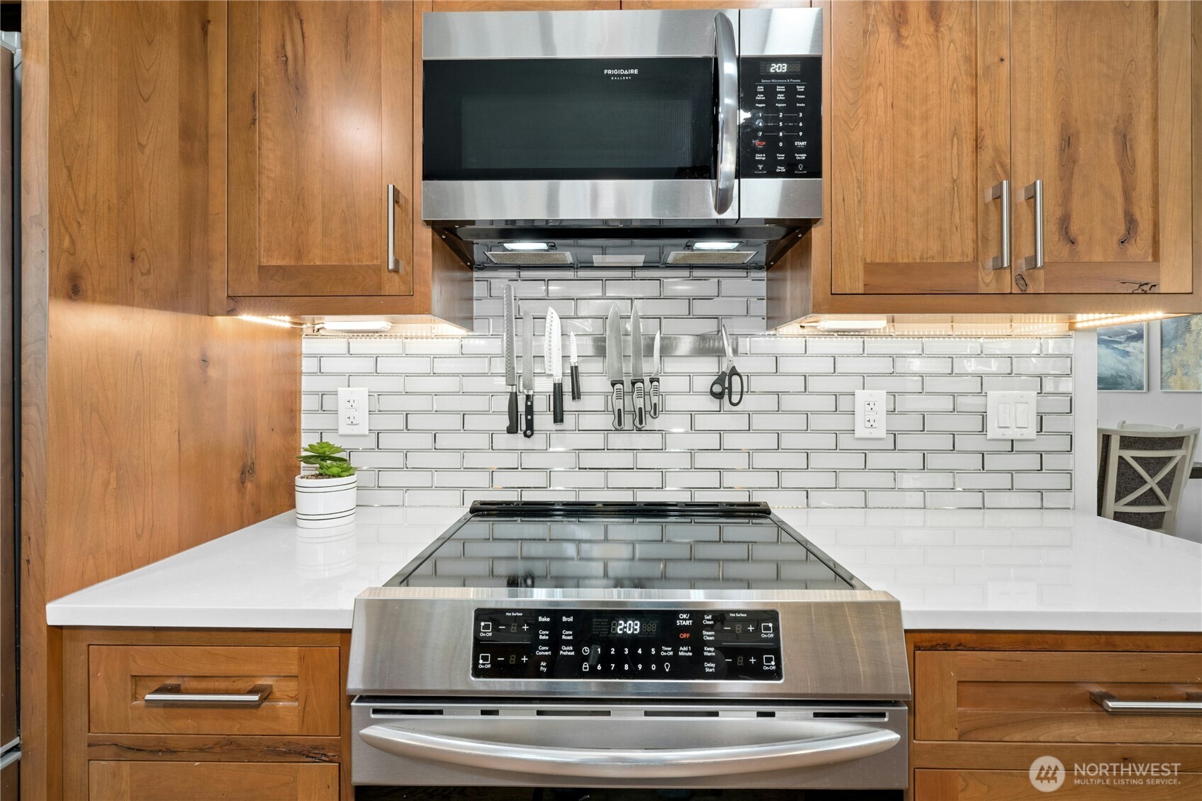 24022 4th Place West Bothell, WA 98021 - Photo 6 of 36 a stove top oven sitting inside of a kitchen