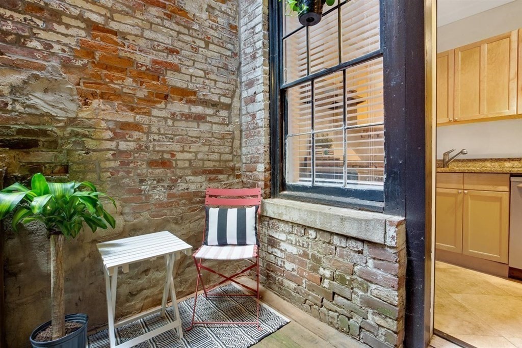 60 Myrtle Street, Unit 1 Boston, MA 02114 - Photo 11 of 14 a bathroom with a toilet sink and mirror
