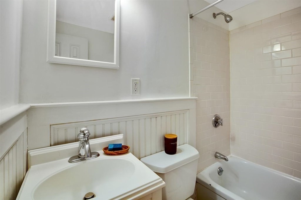 60 Myrtle Street, Unit 1 Boston, MA 02114 - Photo 12 of 14 a bathroom with a sink and bathtub