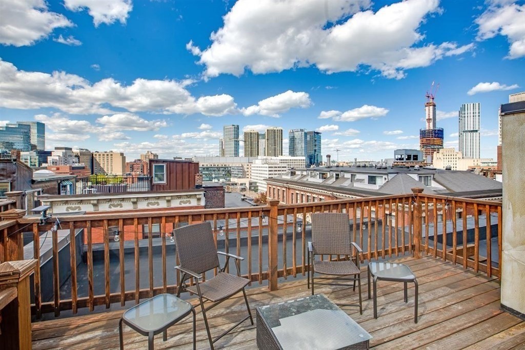60 Myrtle Street, Unit 1 Boston, MA 02114 - Photo 13 of 14 a view of a balcony with wooden benches