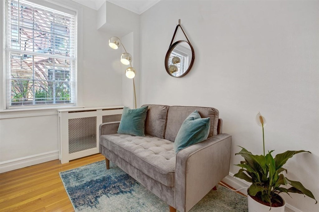 60 Myrtle Street, Unit 1 Boston, MA 02114 - Photo 4 of 14 a living room with furniture and wooden floor