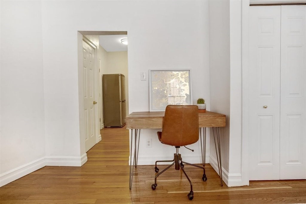 60 Myrtle Street, Unit 1 Boston, MA 02114 - Photo 7 of 14 a living room with furniture and a window