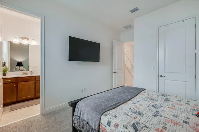 a spacious bathroom with a double vanity sink mirror and toilet
