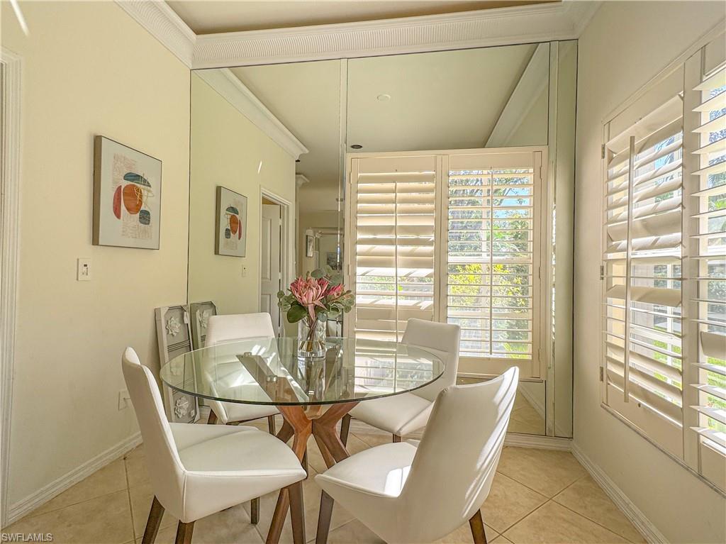 152 Napa Ridge Way Naples, FL 34119 - Photo 37 of 50 a view of a dining room with furniture window and outside view