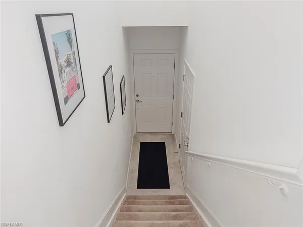 a view of a hallway with staircase
