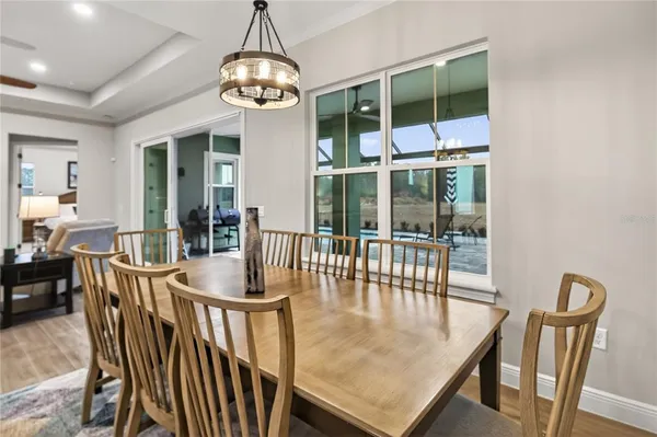 a view of a dining room and a wooden floor