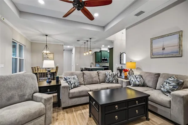 a living room with furniture and a fireplace