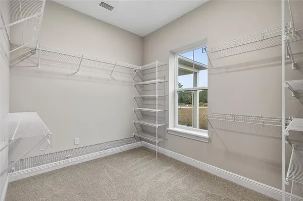 a view of a workspace with furniture and wooden floor