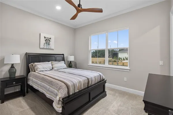 a bedroom with a bed and a mirror
