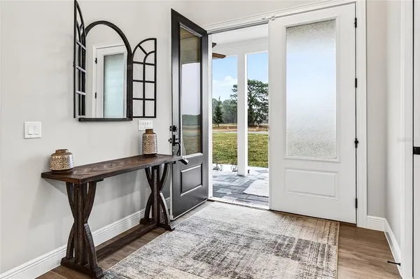 a view of a kitchen cabinets and wooden floor