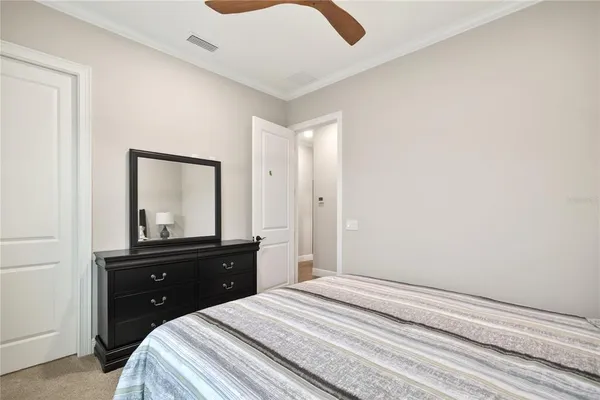 a bathroom with a sink vanity mirror and toilet