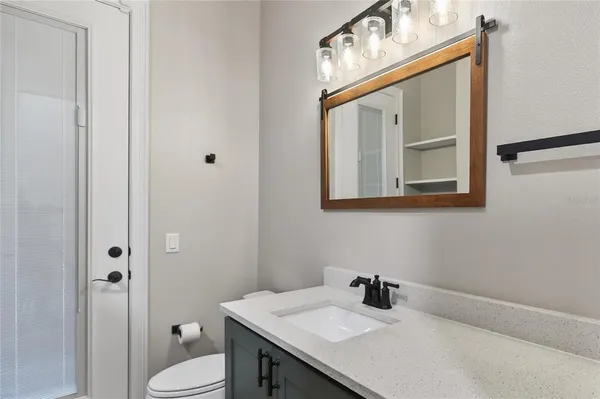 a bathroom with a tub a sink and a shower