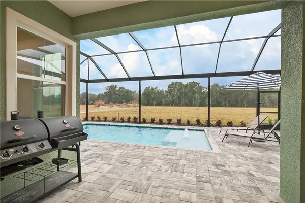 a view of a swimming pool with a porch