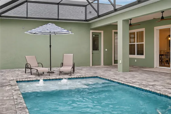 a aerial view of a house with big yard