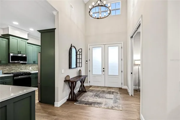 a kitchen with stainless steel appliances granite countertop a stove and cabinets