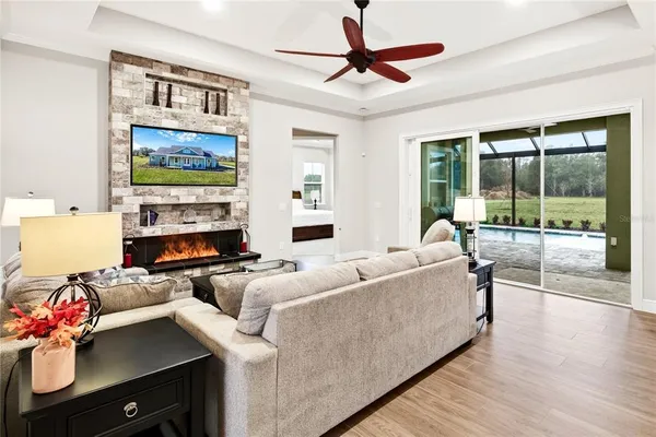 a dining room with furniture window and wooden floor