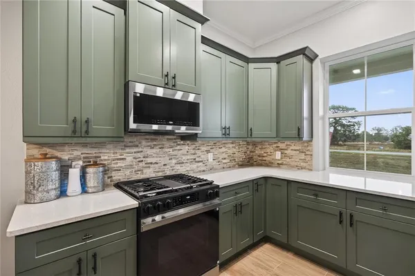a kitchen with a refrigerator and a sink